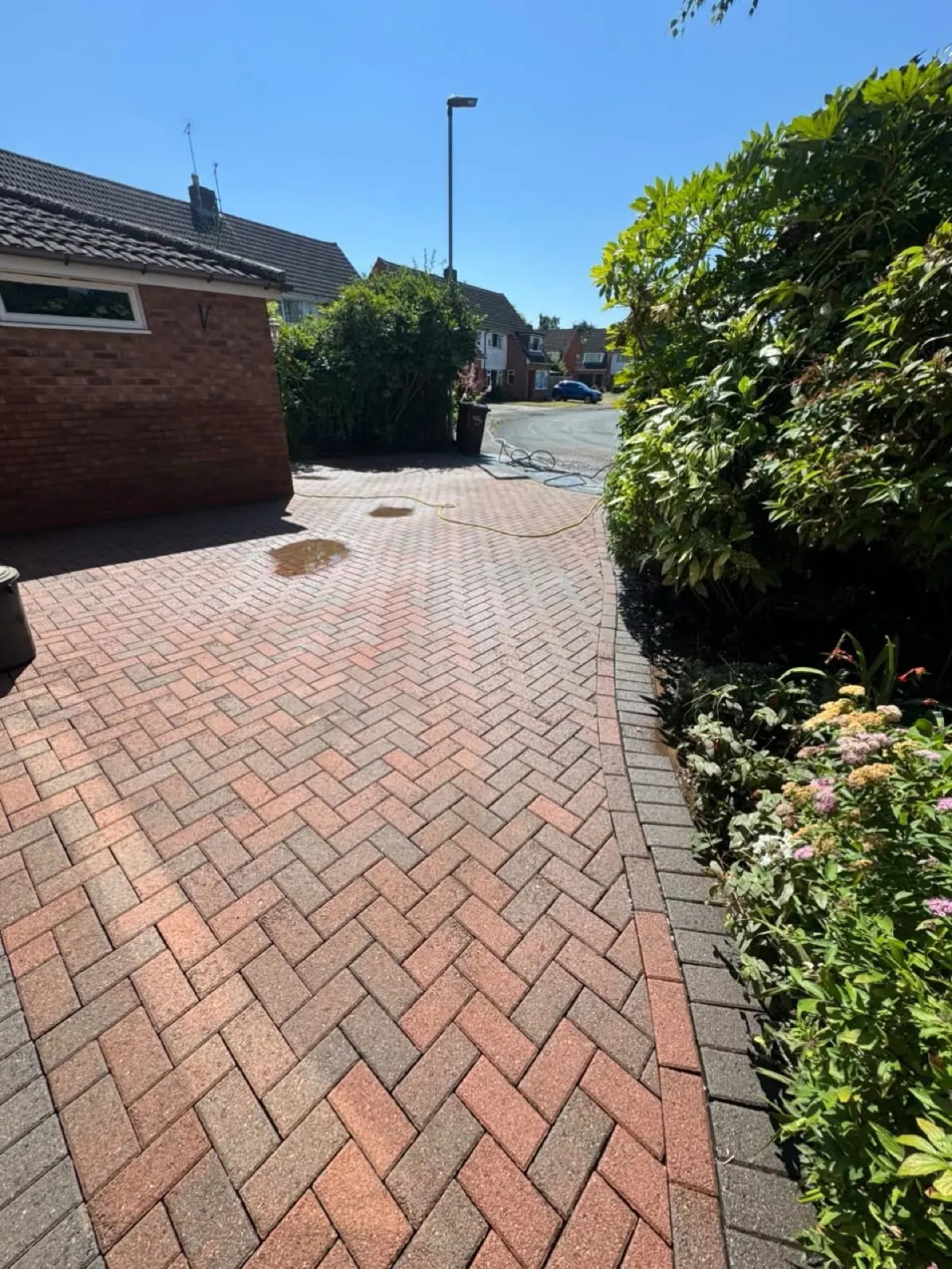 The same block-paving driveway after cleaning — bright, even and weed-free