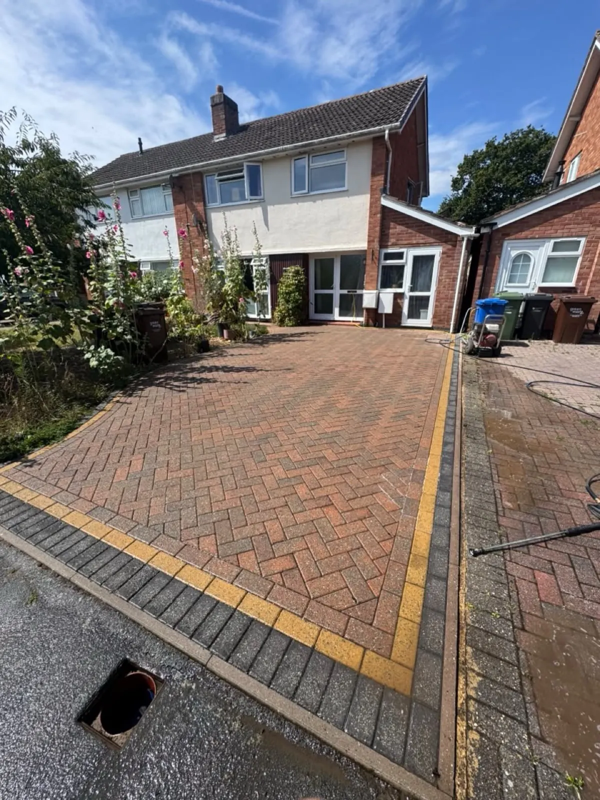 Freshly cleaned block-paving driveway outside a Herefordshire home